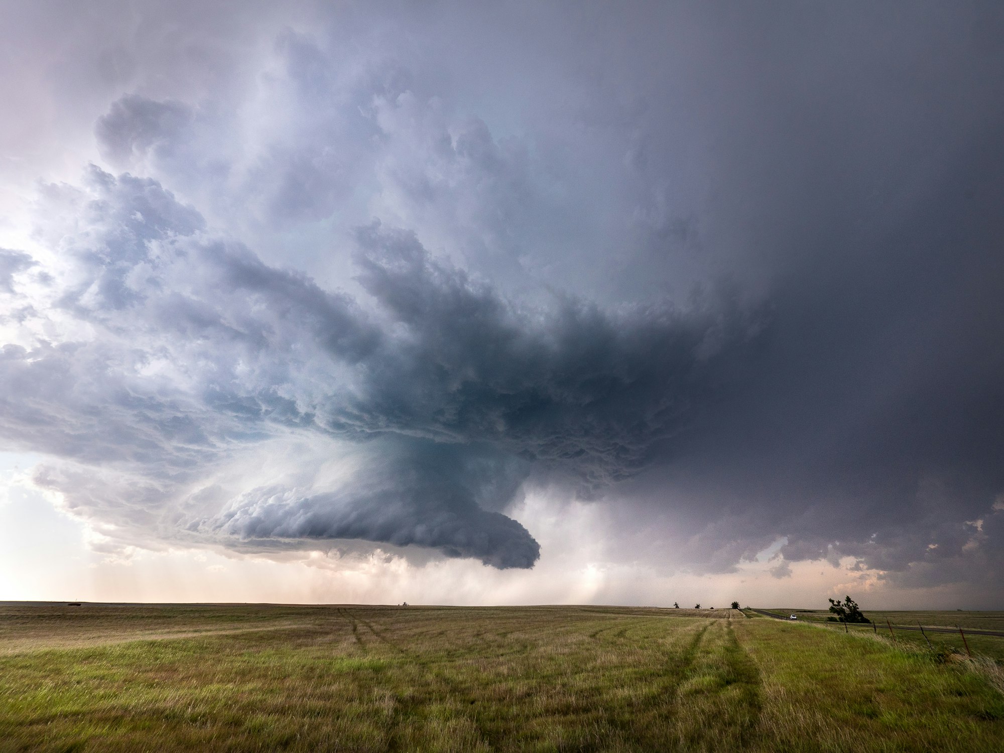 A supercell thunderstorm building over open plains